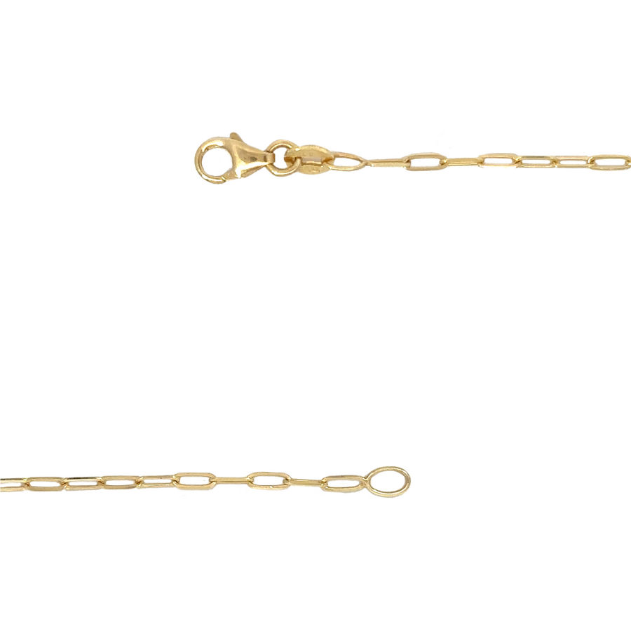 14k gold chain with a classic design resting on a luxury fabric