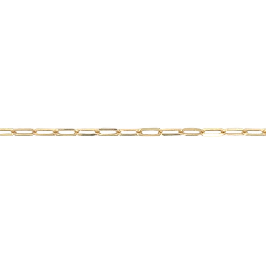 Flat-lay of 14k gold chain beside a jewelry box