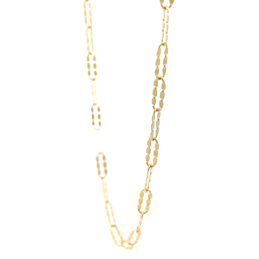 Side view of 14k gold chain in 17.5" length, draping elegantly around the neck