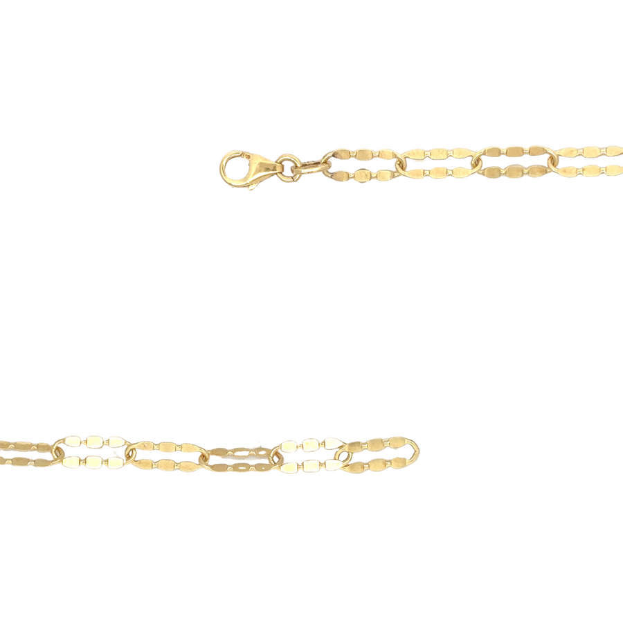 Close-up of 14k gold chain with pendant on a white background