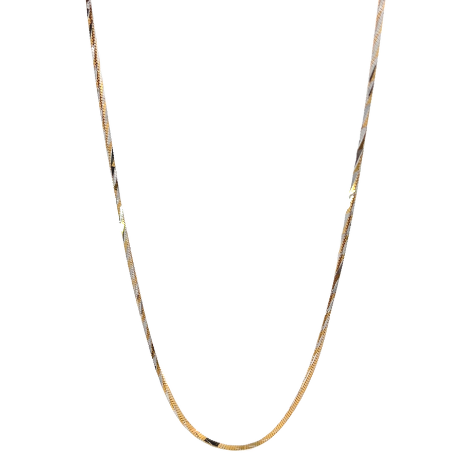 Model wearing the 14k gold chain with two-tone accents, highlighting its elegance