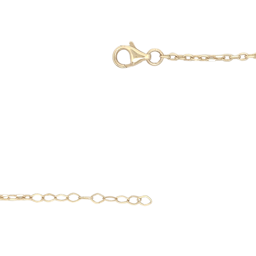 Woman wearing 14k gold CZ chain as a solo statement piece