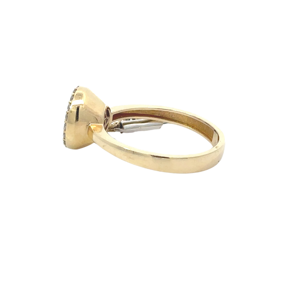 14k gold circle CZ ring stacked with other rings, illustrating its versatility in layered styling.