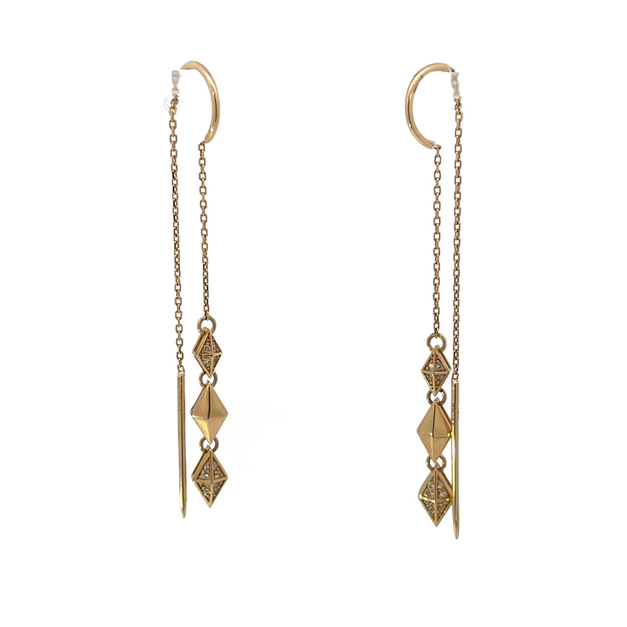 Pair of elegant 14k gold earrings shown in jewelry box