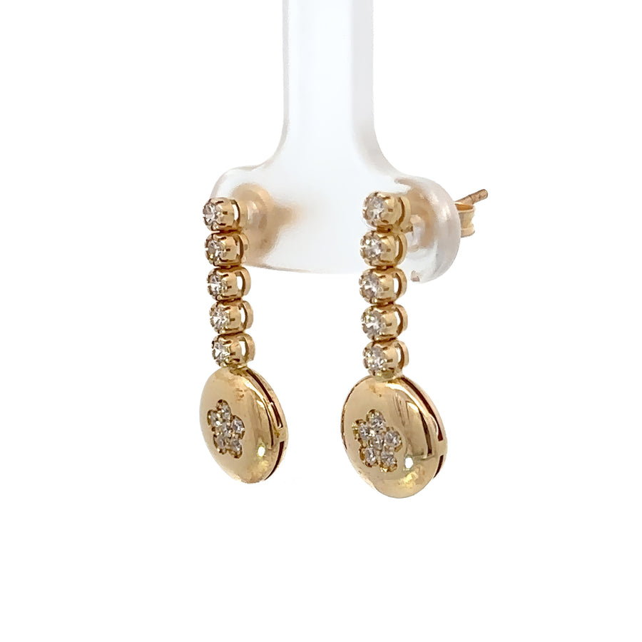 Elegant gold earrings displayed on a white background