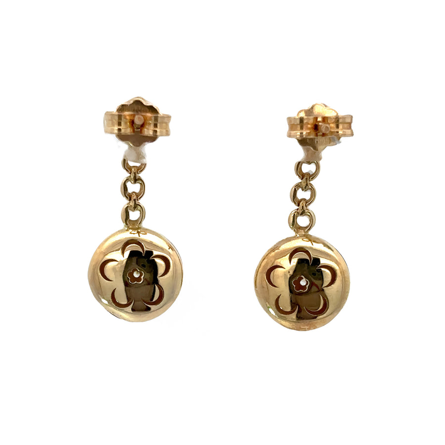 Pair of timeless 14k gold earrings styled with formal attire