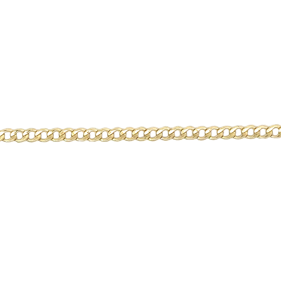 Close-up of solid gold Cuban chain with interlocking links