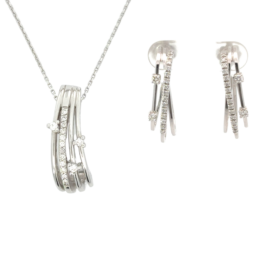 14k gold diamond earrings and pendant set displayed on velvet