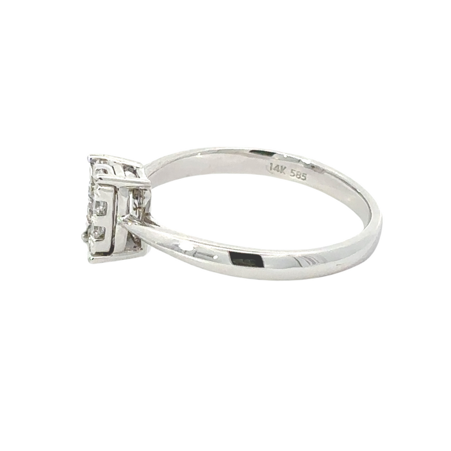 Woman wearing 14k gold diamond ring on finger