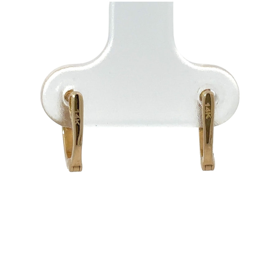 Minimalist diamond earrings on white background