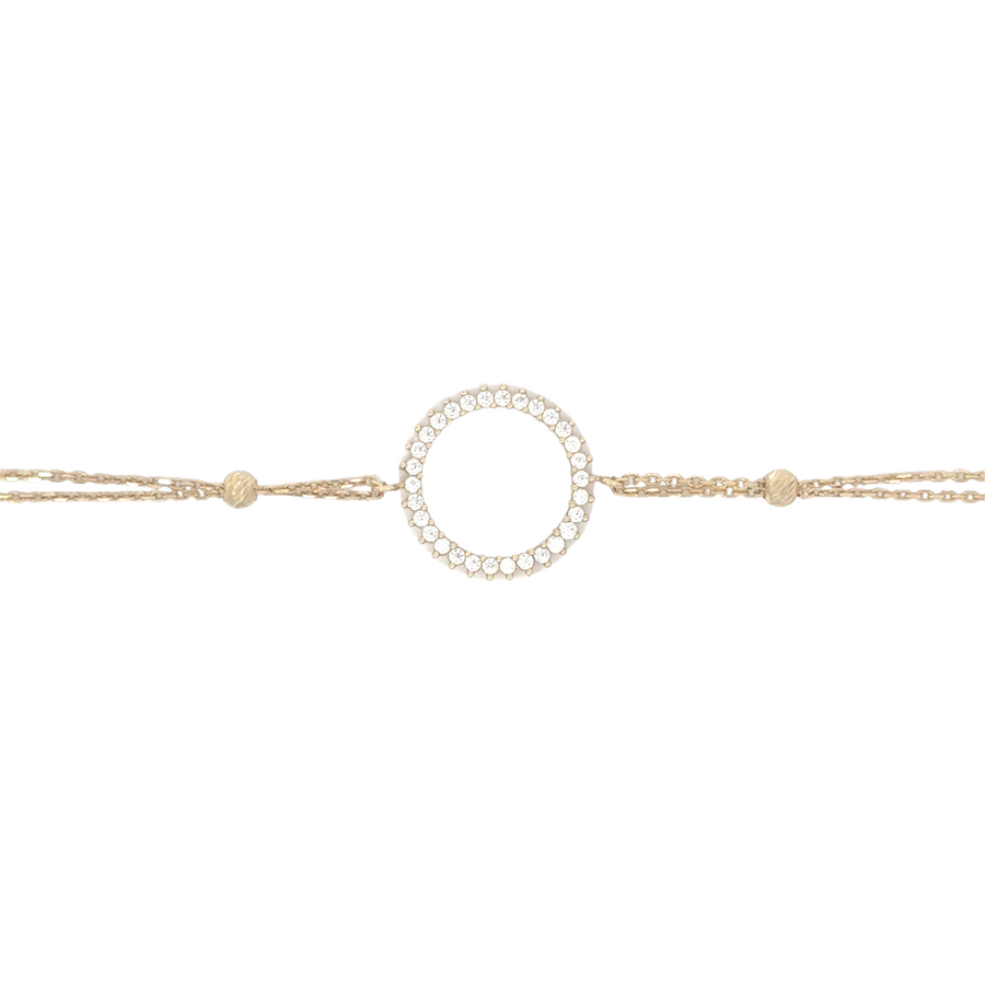 Side view showing slim gold chain and shimmering CZ centerpiece