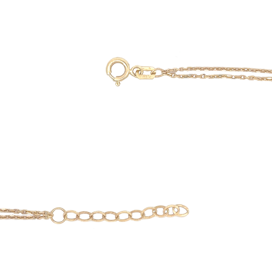 14k gold double circle bracelet styled with other gold jewelry pieces