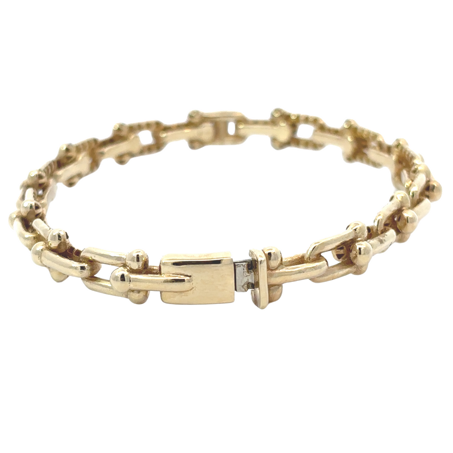 High-polish finish gold bangle with chic details