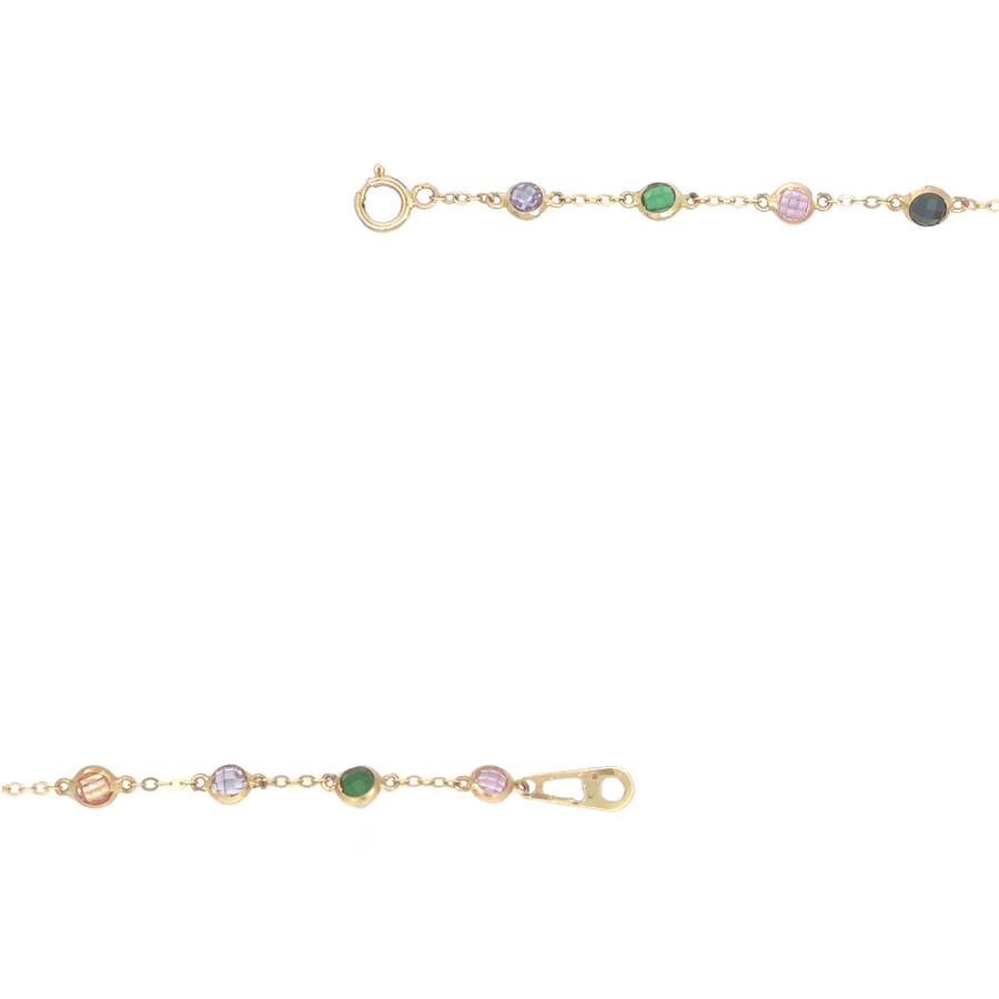 Detail shot of 14k gold necklace with multi-colored stones, highlighting its delicate craftsmanship.