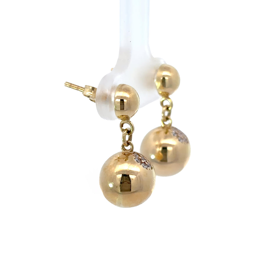 Close-up of cubic zirconia ball drop earrings