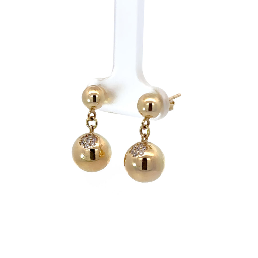 Lightweight gold drop earrings shown against white background