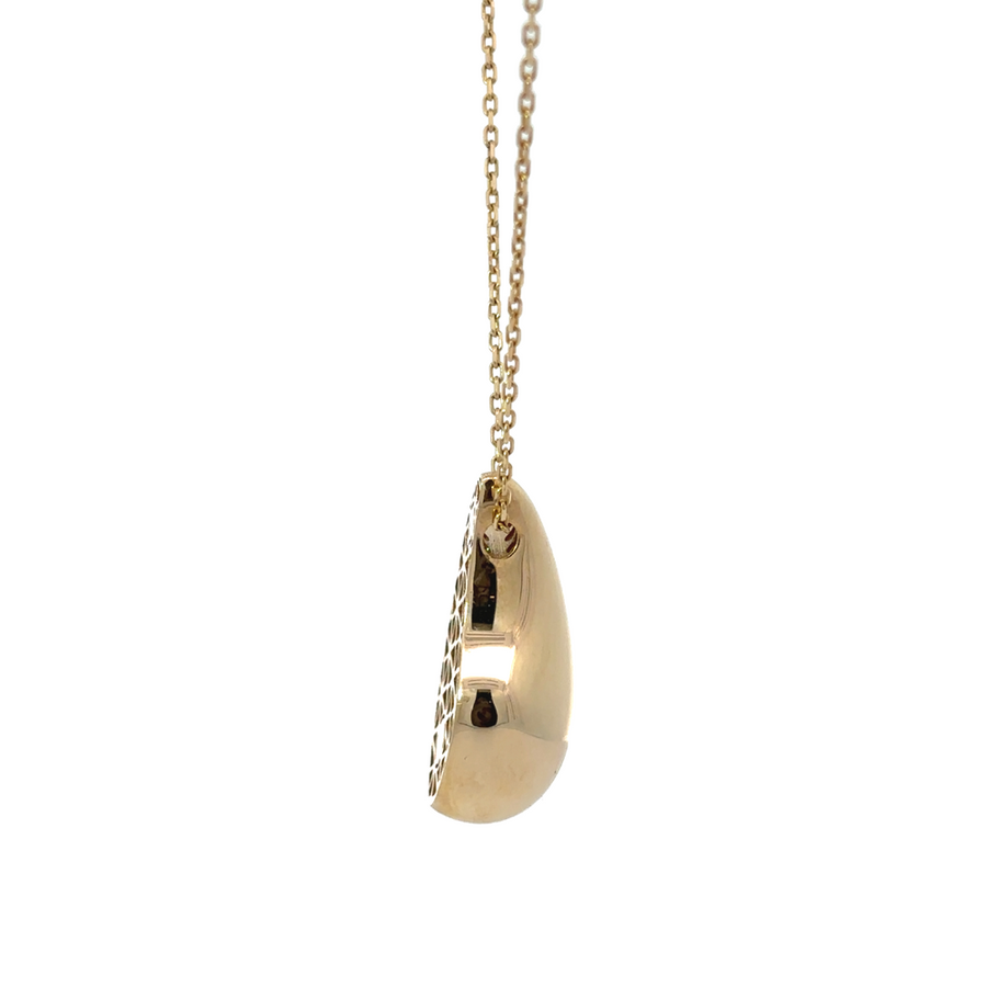 Model wearing the 14k gold drop necklace, showcasing the elegant pendant and adjustable length.