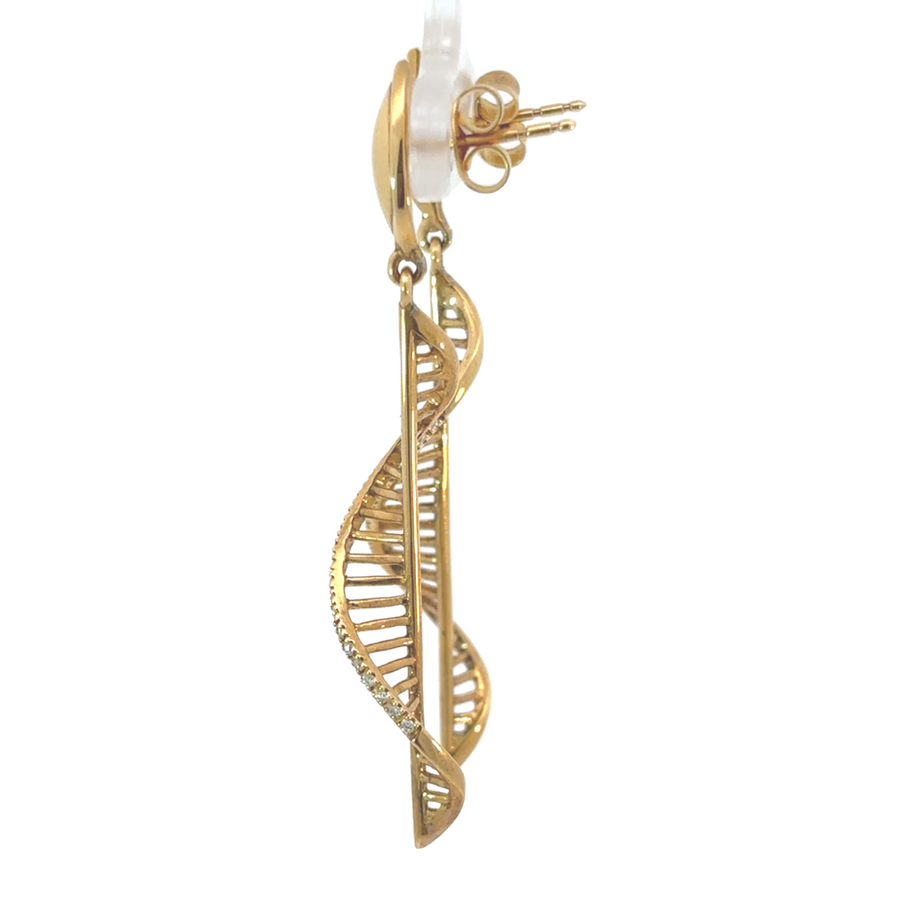 Close-up of diamond-studded 14k gold earring pendant