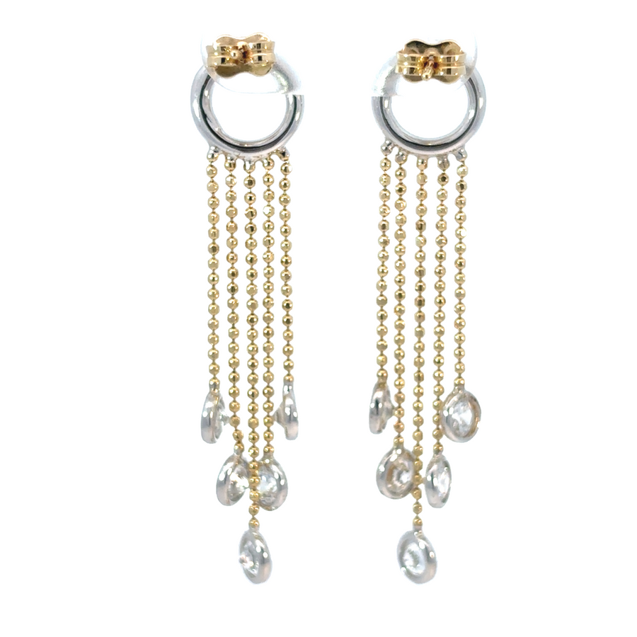 Close-up of 14k gold earrings with dazzling Swarovski crystal accents