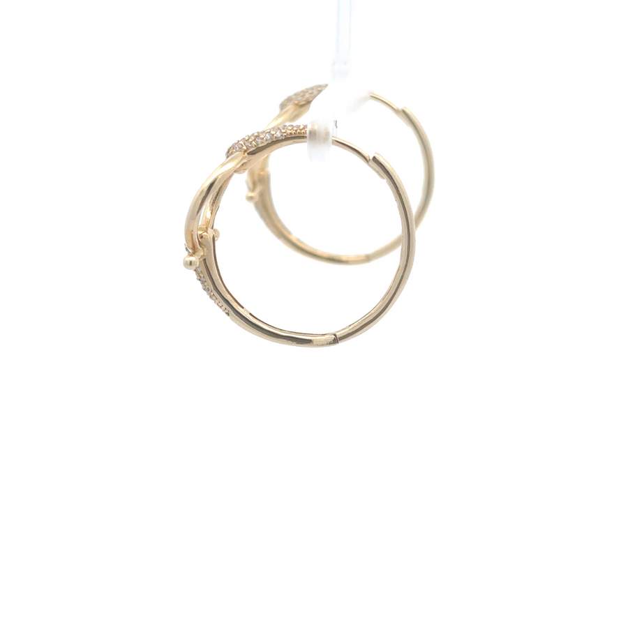 Close-up of classic 14k gold earrings showing smooth finish