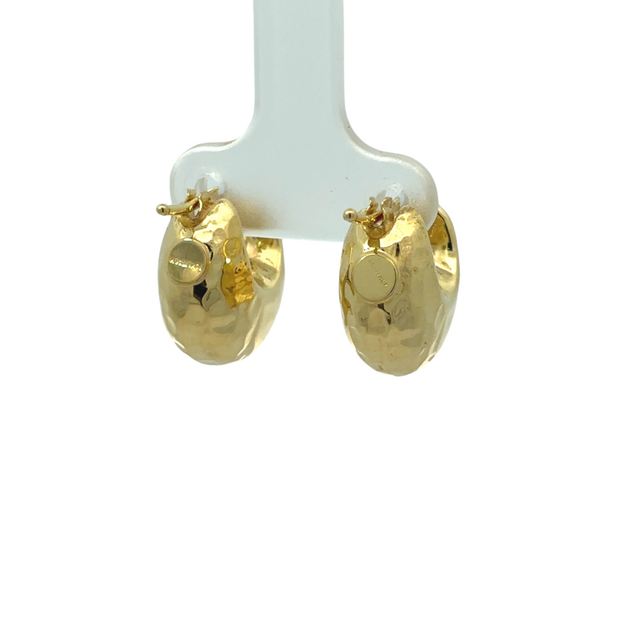 Polished 14k gold earrings reflecting light beautifully
