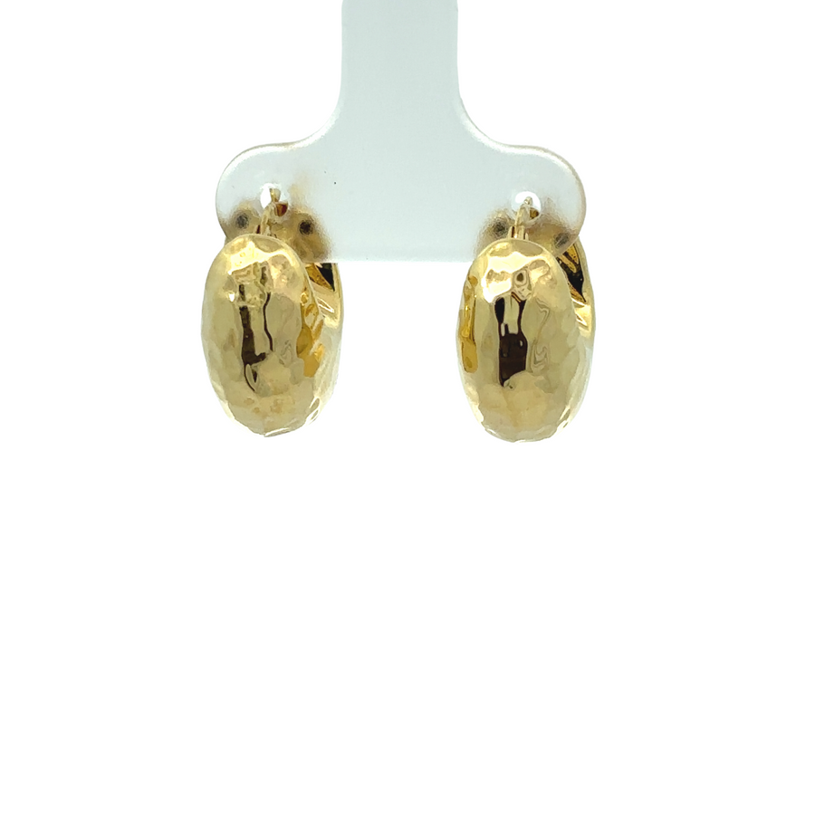 Close-up of classic 14k gold earrings with polished finish