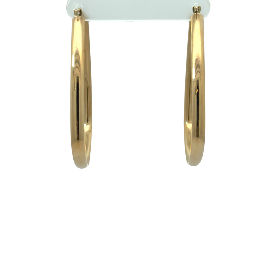 Shiny 14k gold earrings reflecting light beautifully