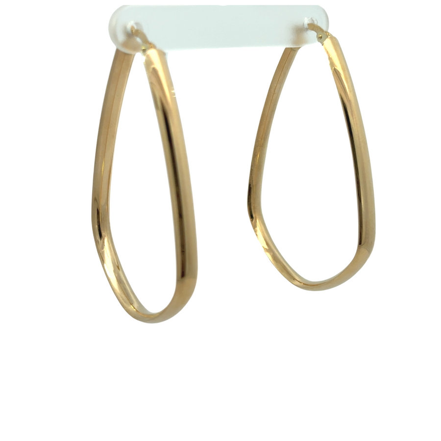 Close-up of elegant 14k gold earrings with polished surface