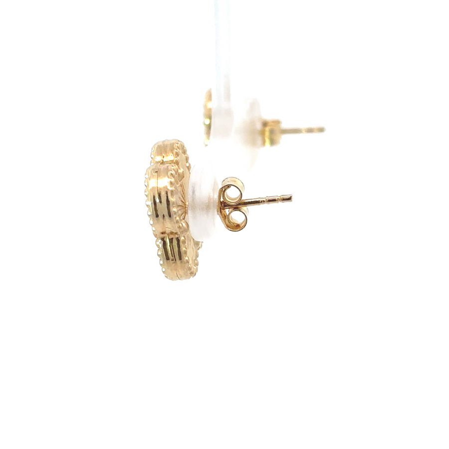 Close-up of 14k gold earrings highlighting smooth finish
