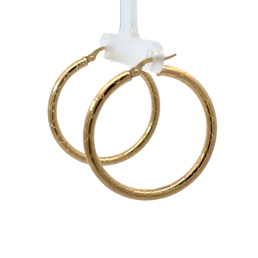 Medium gold earrings styled with casual outfi