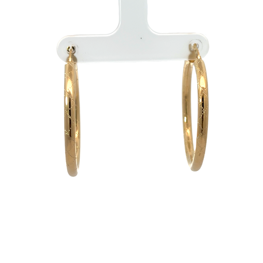 Medium-sized 14k gold earrings on a white background