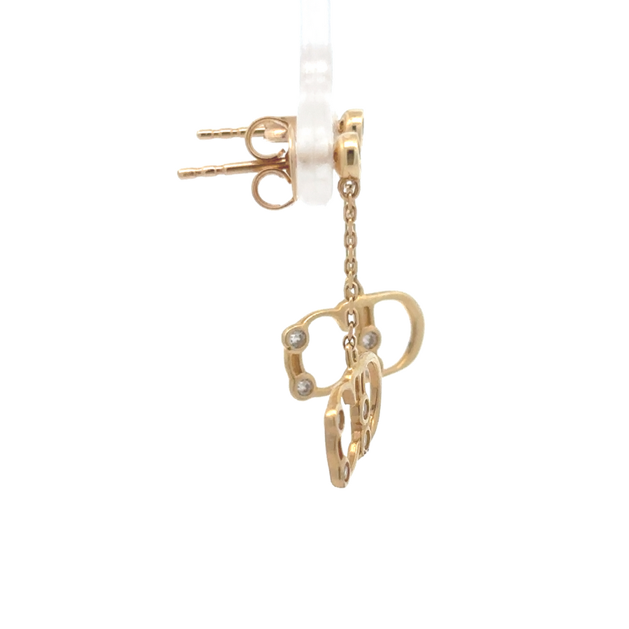 Side view of gold earrings showcasing minimal design