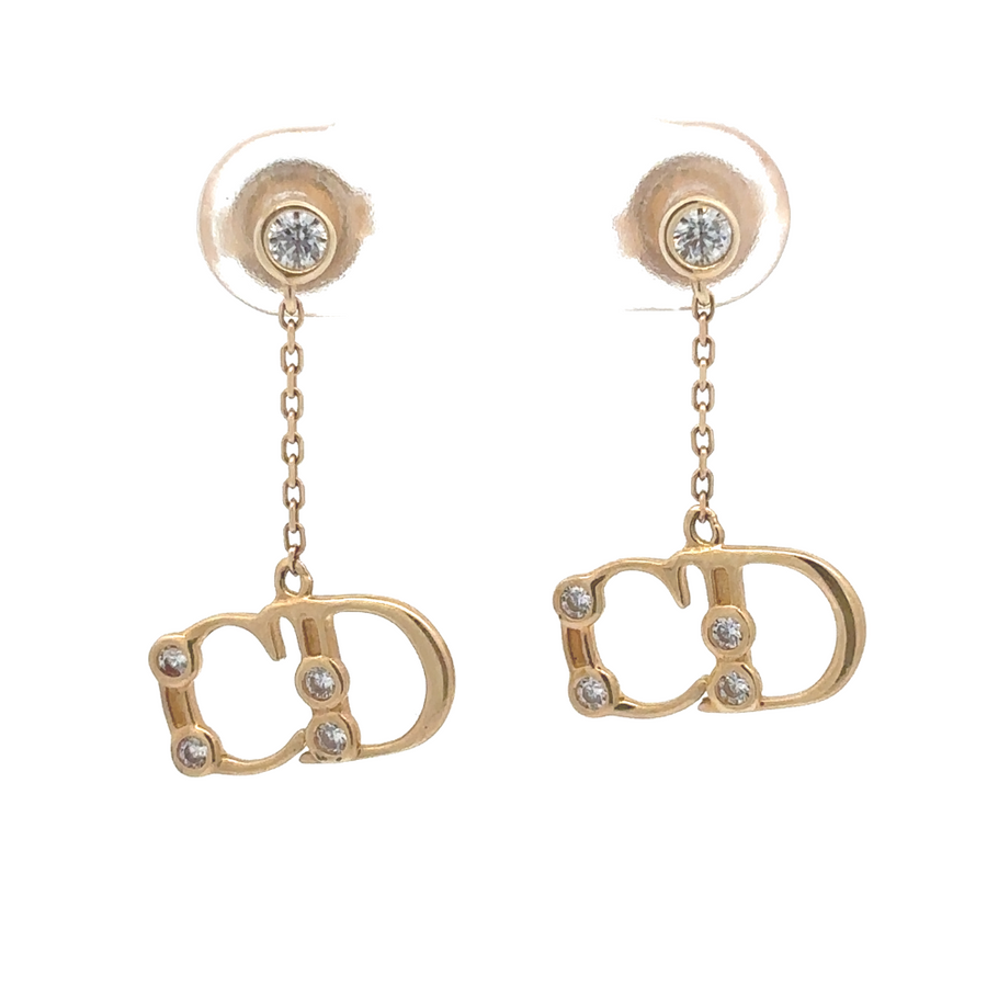 Pair of elegant 14k gold earrings on a white background