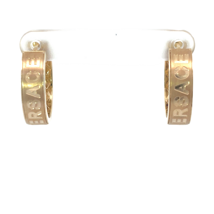 Flat-lay of classic gold earrings, perfect for everyday wear