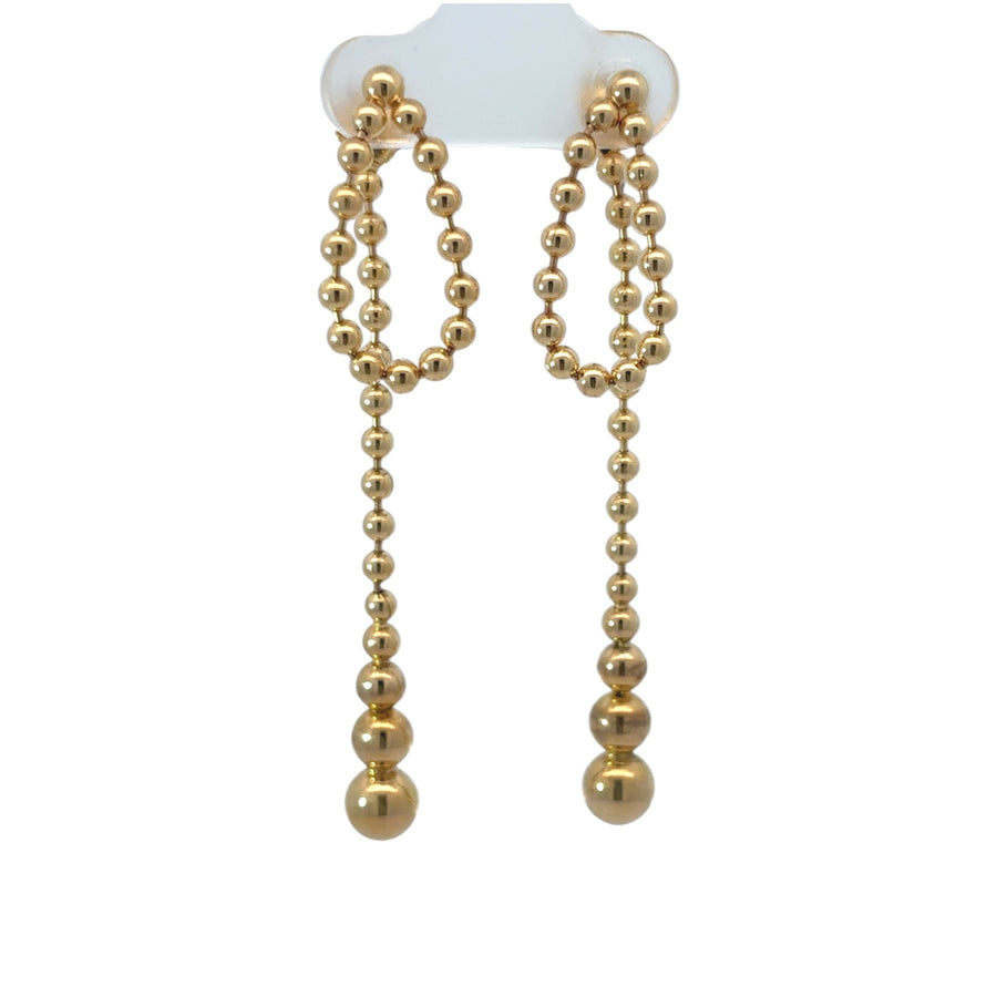 14k gold earrings on white background