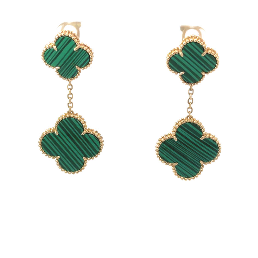 Close-up of 14k gold earrings on white background