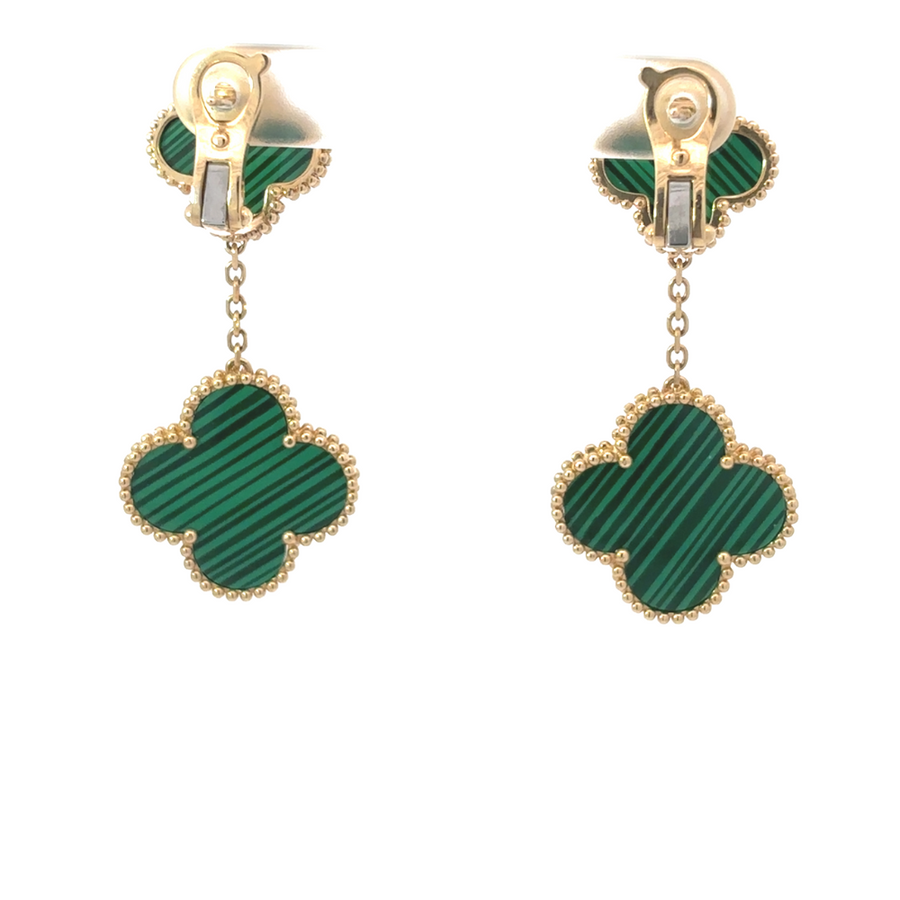 Side view of elegant 14k gold earrings worn with hair tucked back