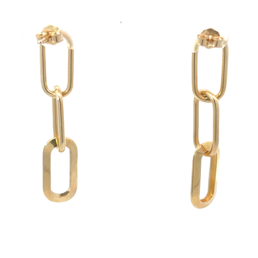 Detailed shot of the 14k gold earrings, emphasizing their smooth finish and polished appearance.