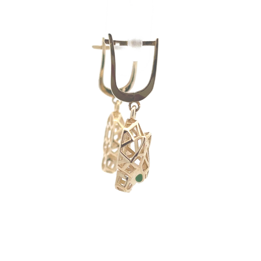 Pair of 14k gold earrings shining under studio lights