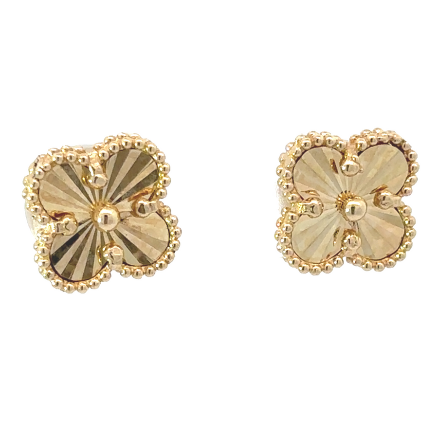 Pair of 14k gold earrings on a neutral background
