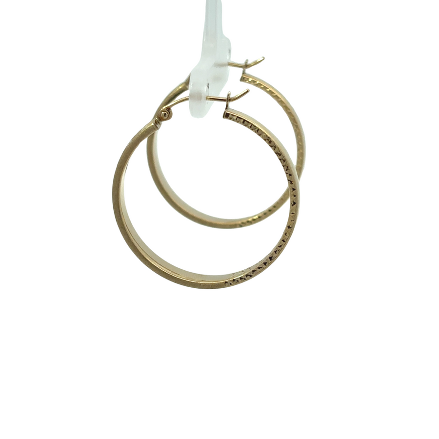 Timeless 14k gold earrings on white background