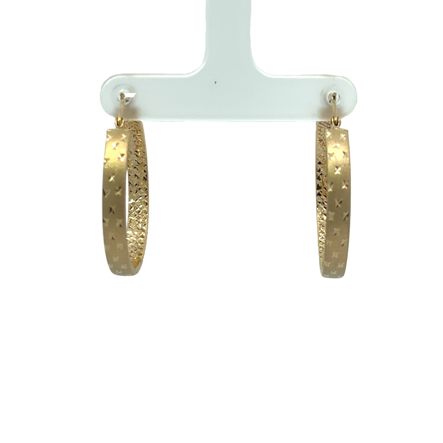 Close-up of 14k gold earrings with polished finish