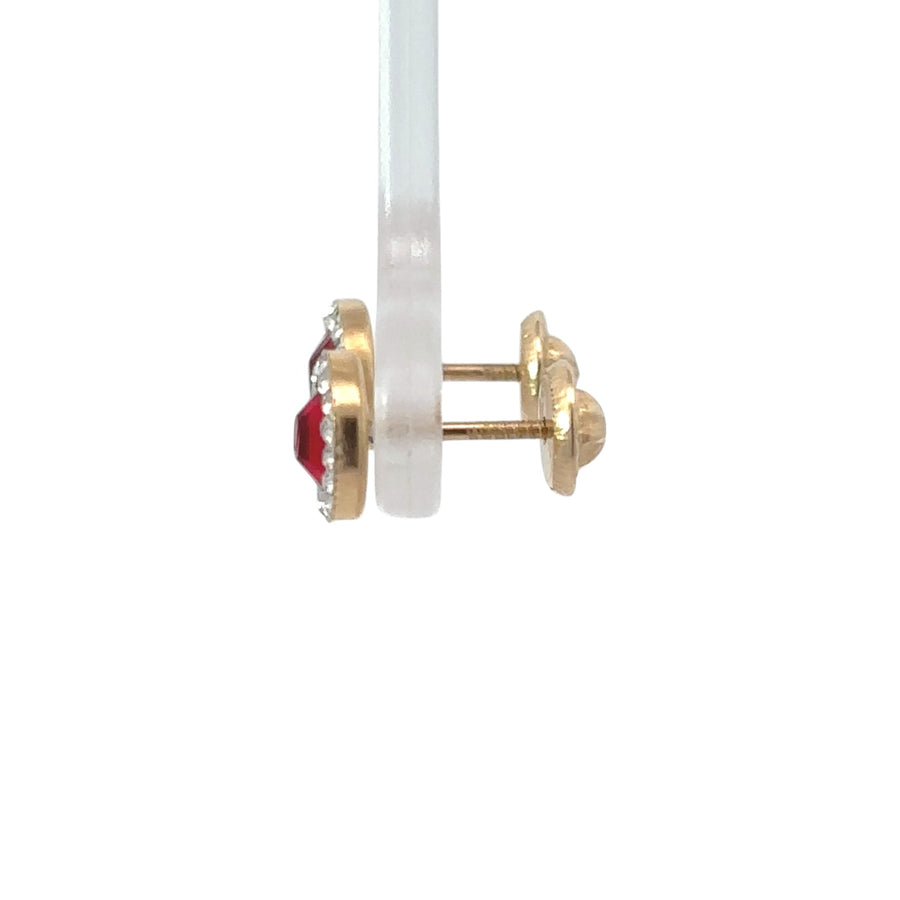 14k gold earrings with smooth polished finish on white background