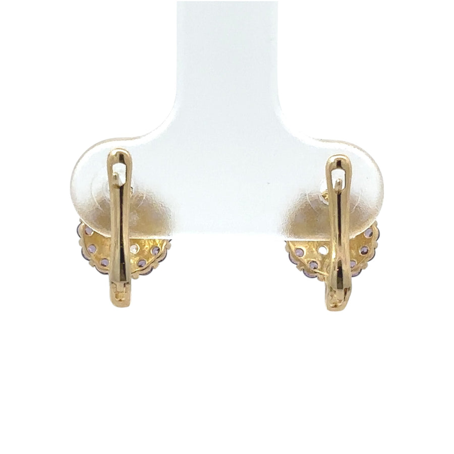 Close-up of 14k gold earring with polished finish