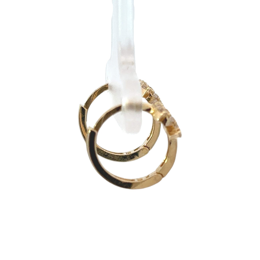Close-up of elegant 14k gold earrings on white background