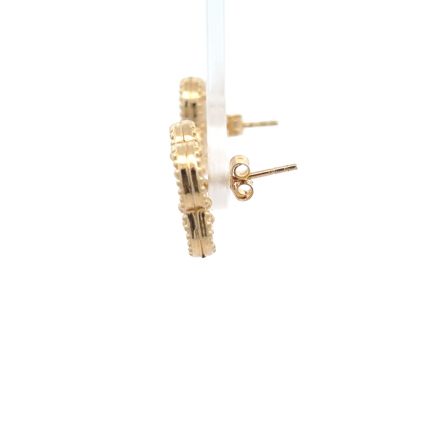 Close-up of 14k gold earrings showing polished finish