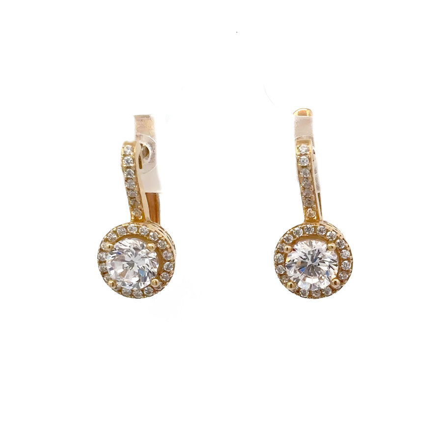 Close-up of classic 14k gold earrings on white background