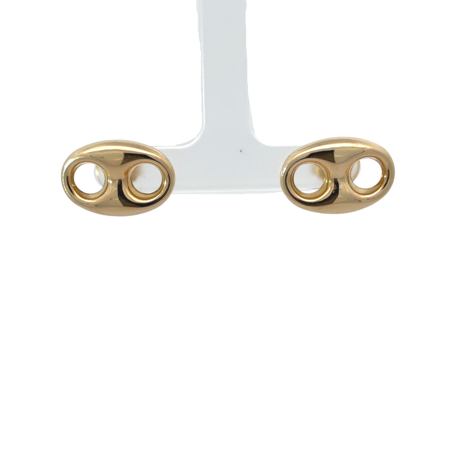 Pair of classic 14k gold earrings on white background
