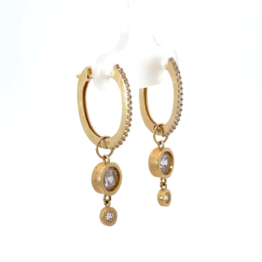 Pair of 14k gold earrings showcasing minimalist design
