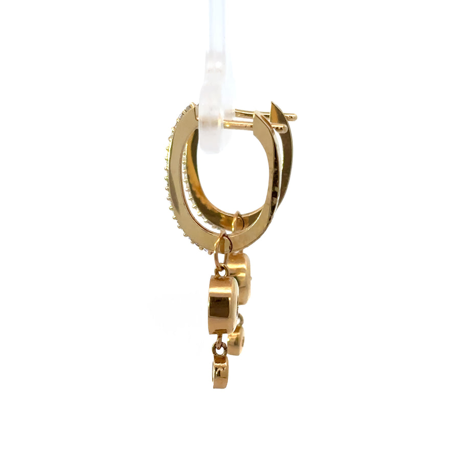 Women wearing elegant 14k gold earrings with natural light